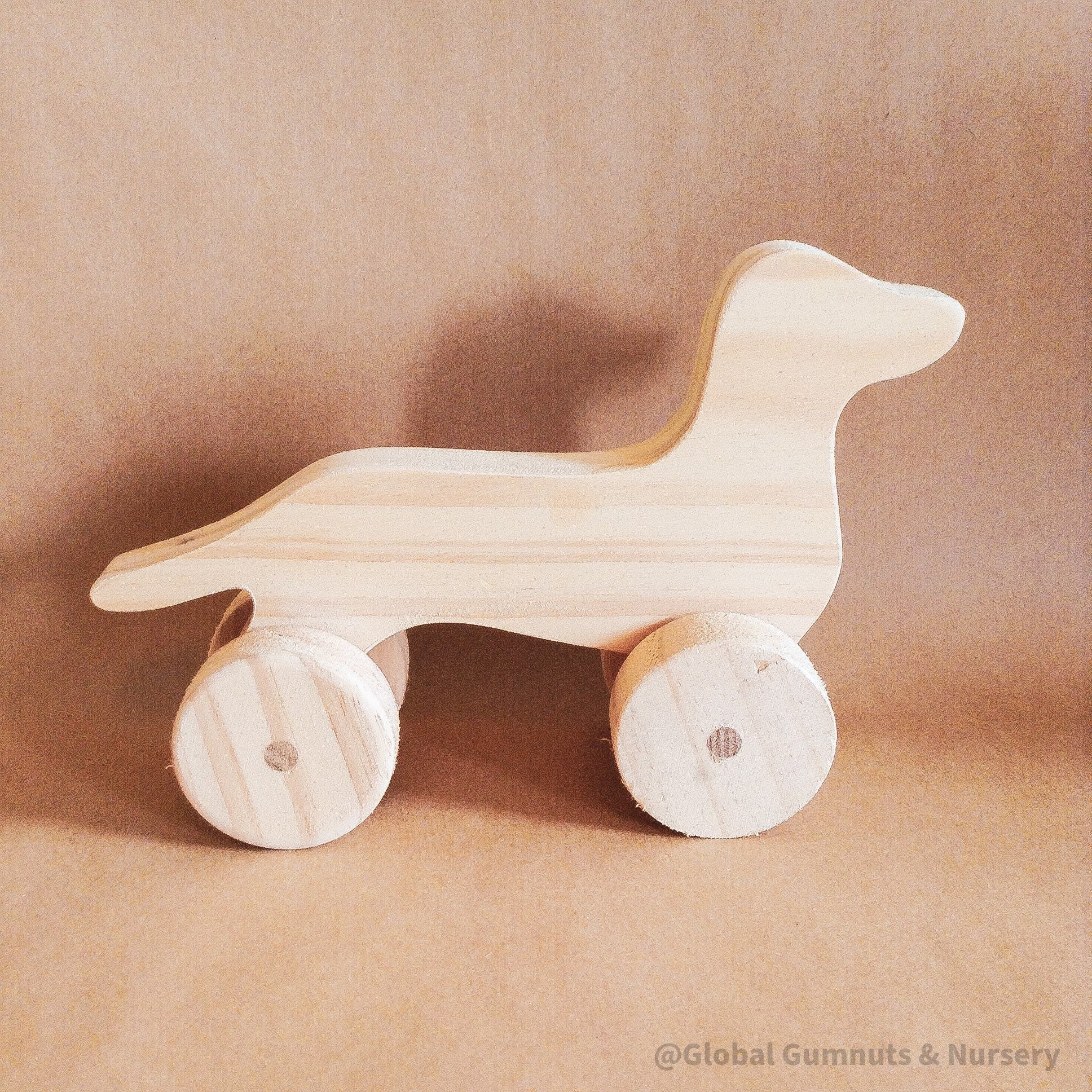 Wooden Dachshund Toy: Handmade wooden dachshund toy, perfect as a first pet gift.