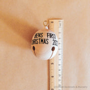 Wooden bell Christmas ornament with chimes, perfect for festive tree decor or rustic holiday charm.
