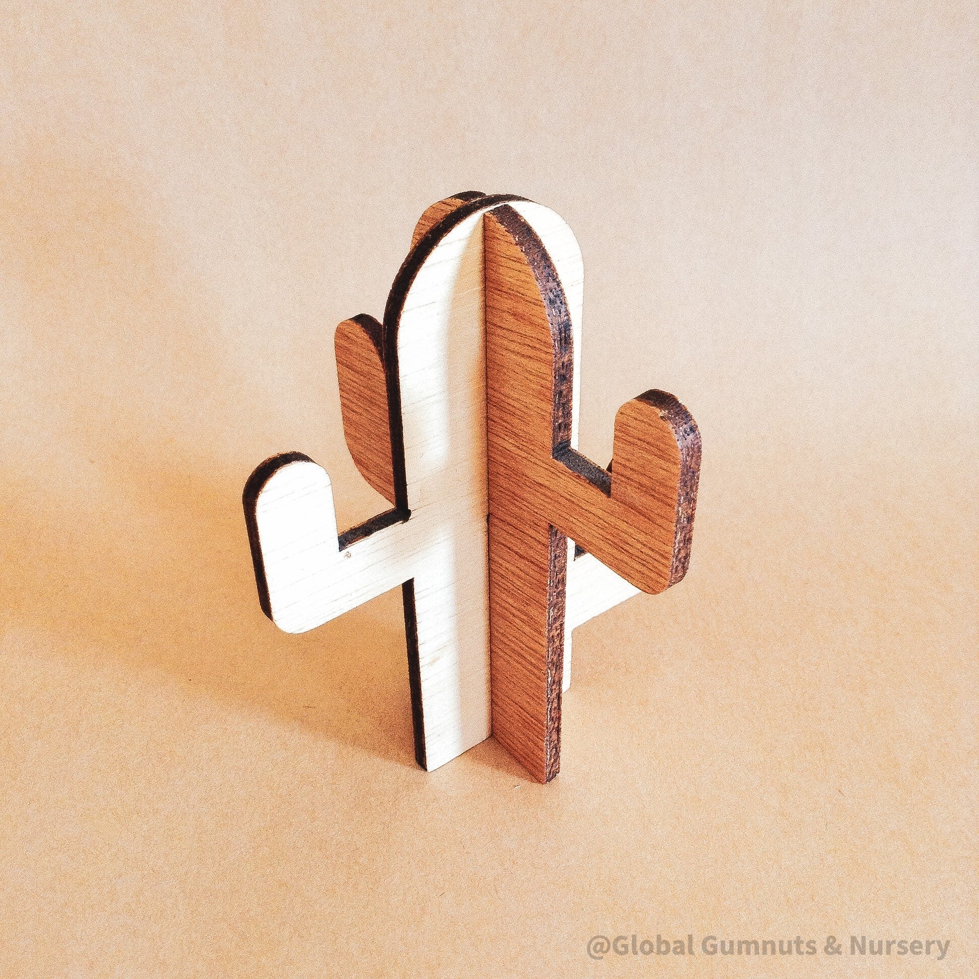 Wooden cactus decor piece, perfect for pretend play or as a cake topper.