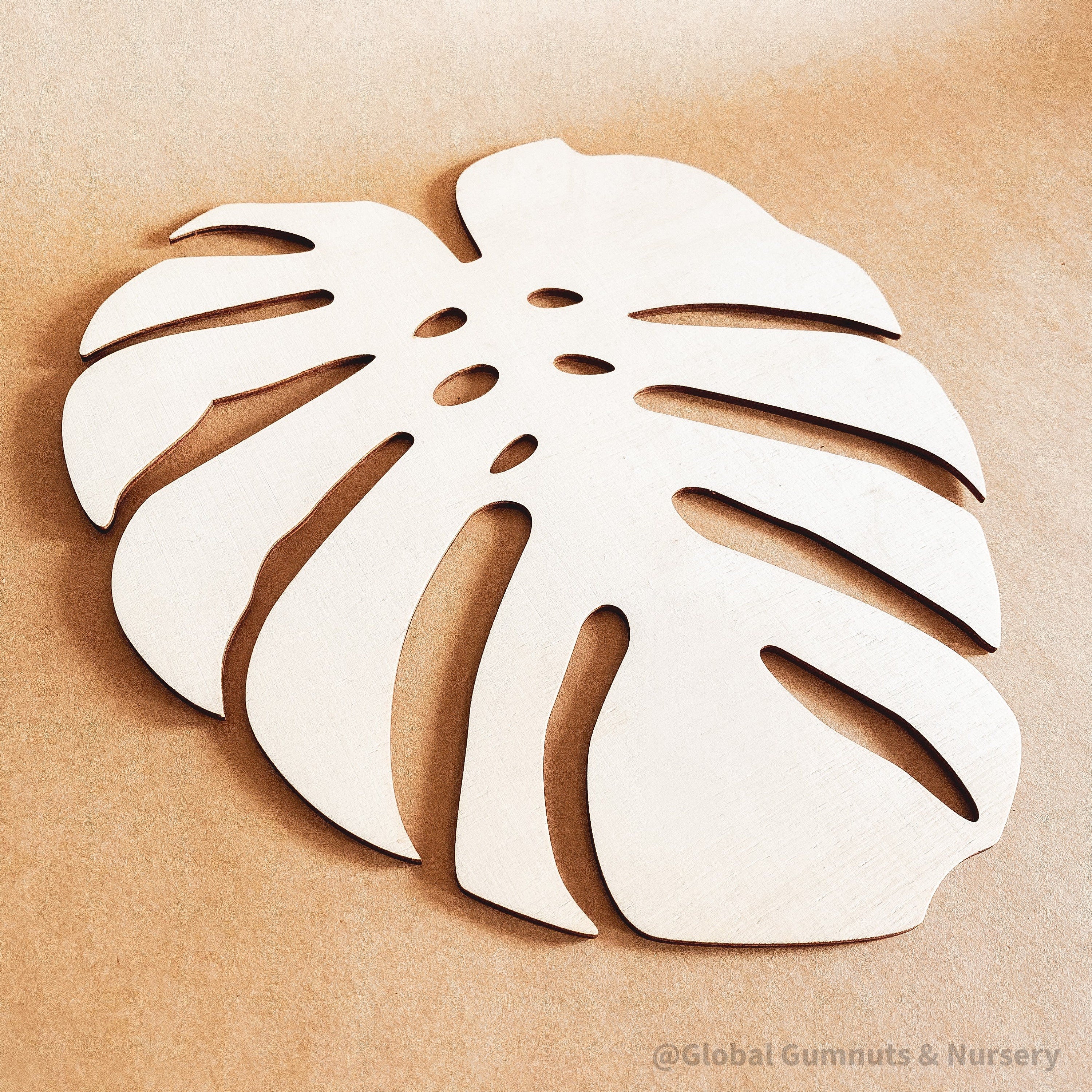 Monstera Leaf: Wooden monstera leaf decor for crafting or home design.