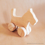 Handmade wooden dog figurine, a playful toy and thoughtful first gift for animal-loving children.
