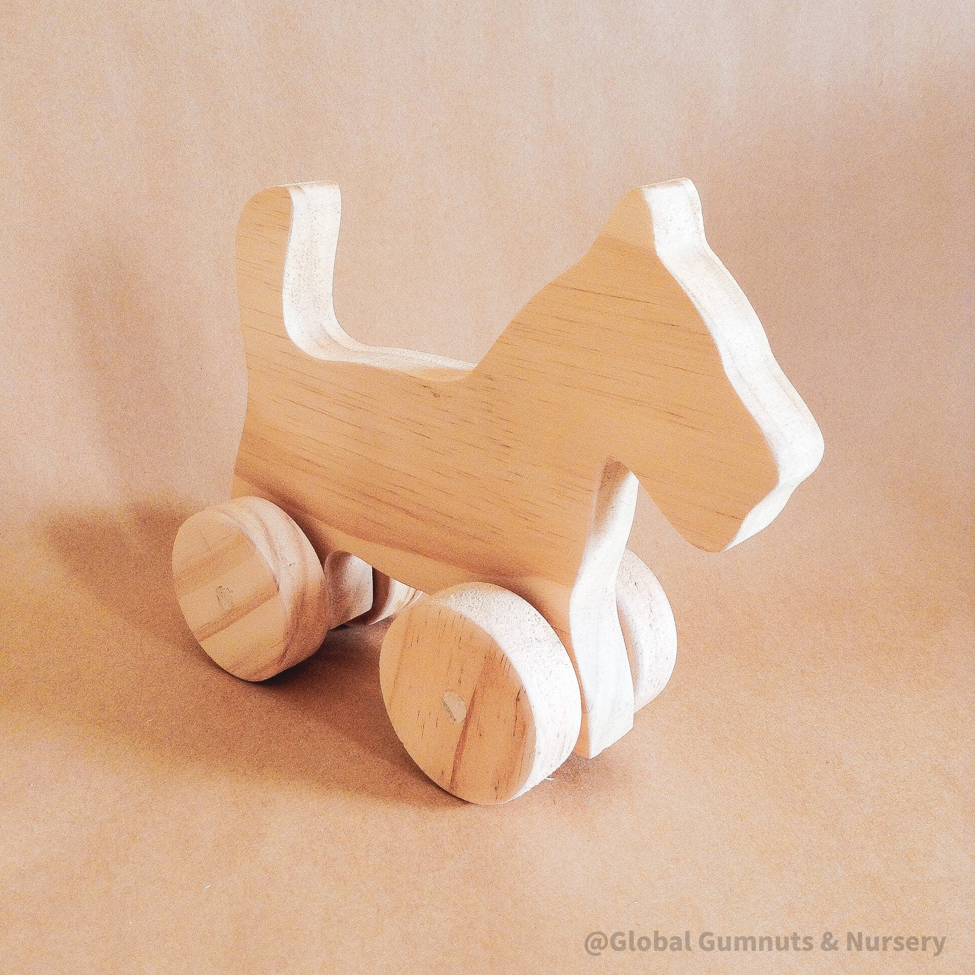 Handmade wooden dog figurine, a playful toy and thoughtful first gift for animal-loving children.
