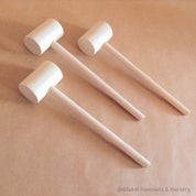 child wooden hammer: child-sized wooden hammer for sensory and motor skills development.