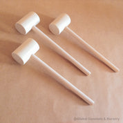 Child Wooden Hammer: Child-sized wooden hammer for sensory and motor skills development.