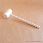 Child Wooden Hammer: Child-sized wooden hammer for sensory and motor skills development.
