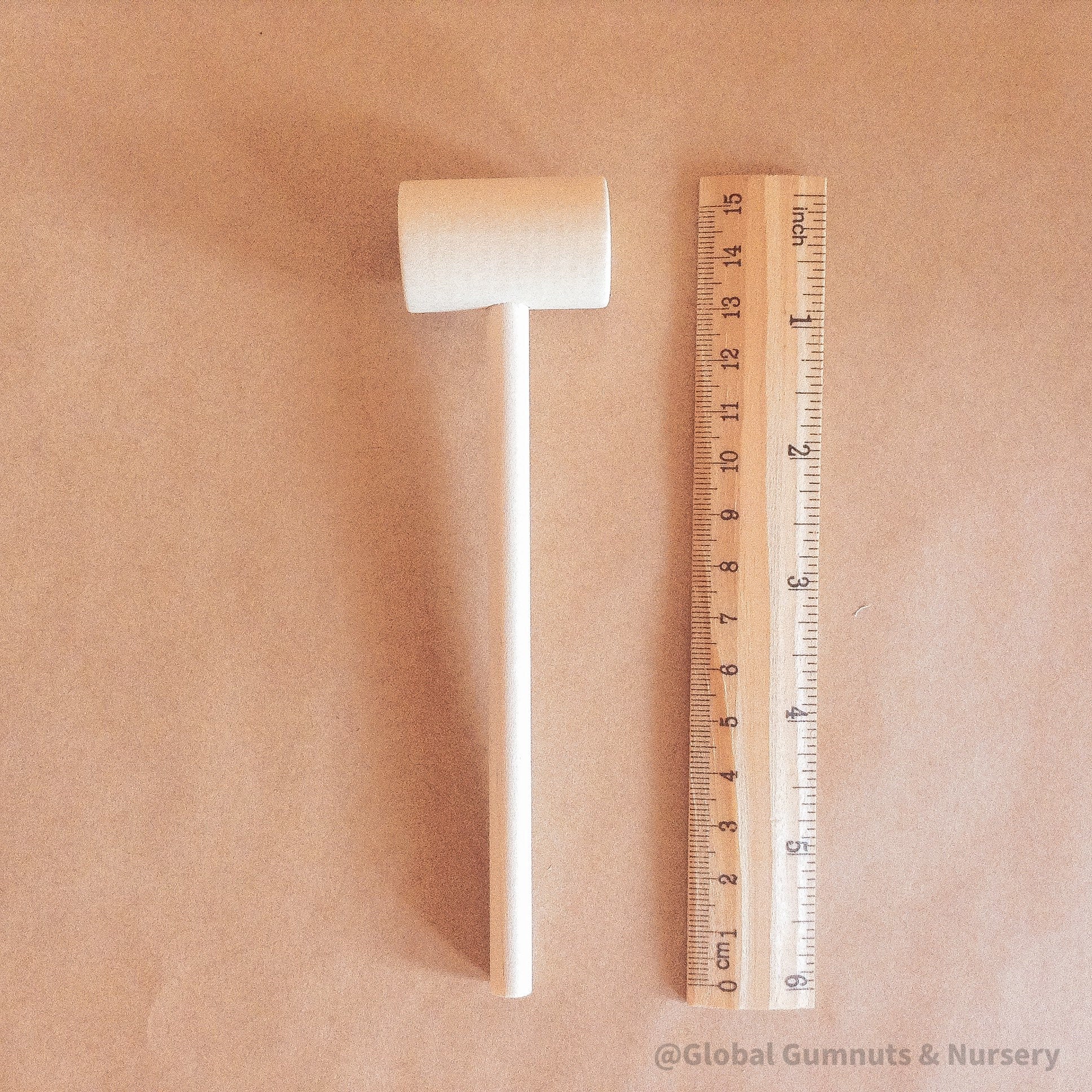 Child Wooden Hammer: Child-sized wooden hammer for sensory and motor skills development.
