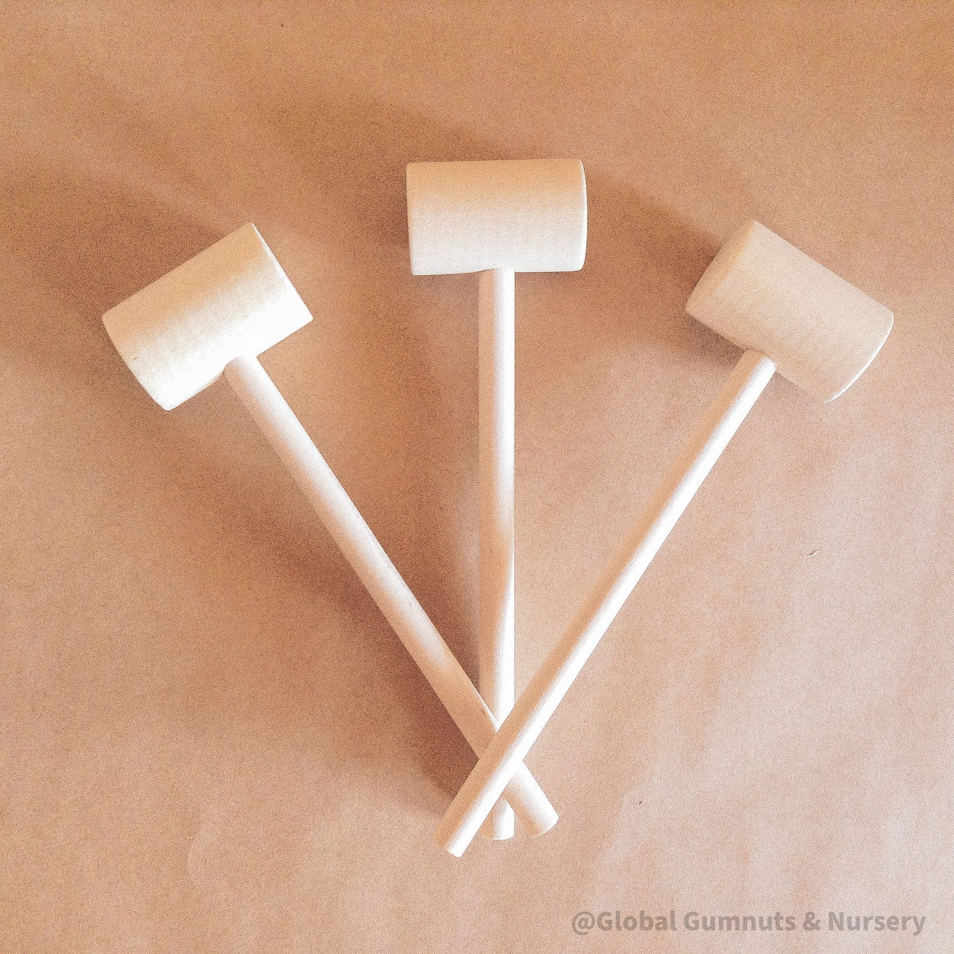 Child Wooden Hammer: Child-sized wooden hammer for sensory and motor skills development.