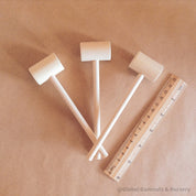 Child Wooden Hammer: Child-sized wooden hammer for sensory and motor skills development.