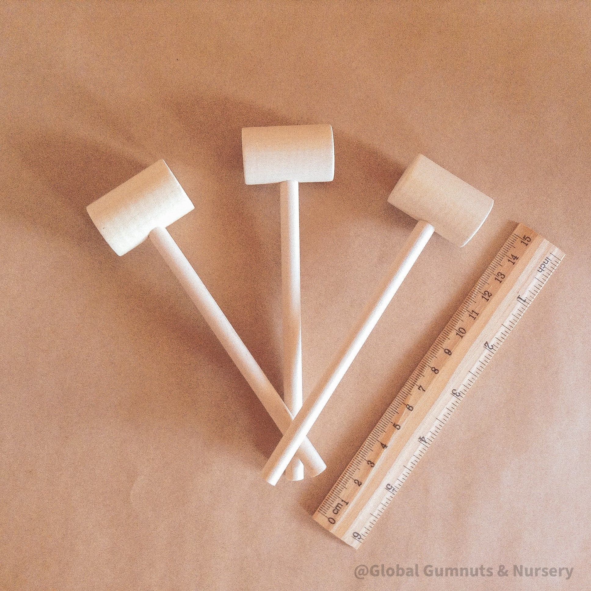 Child Wooden Hammer: Child-sized wooden hammer for sensory and motor skills development.
