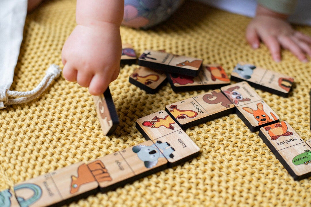 Heads and Tails game featuring Australian native animals, a wooden Montessori toy for fun learning.
