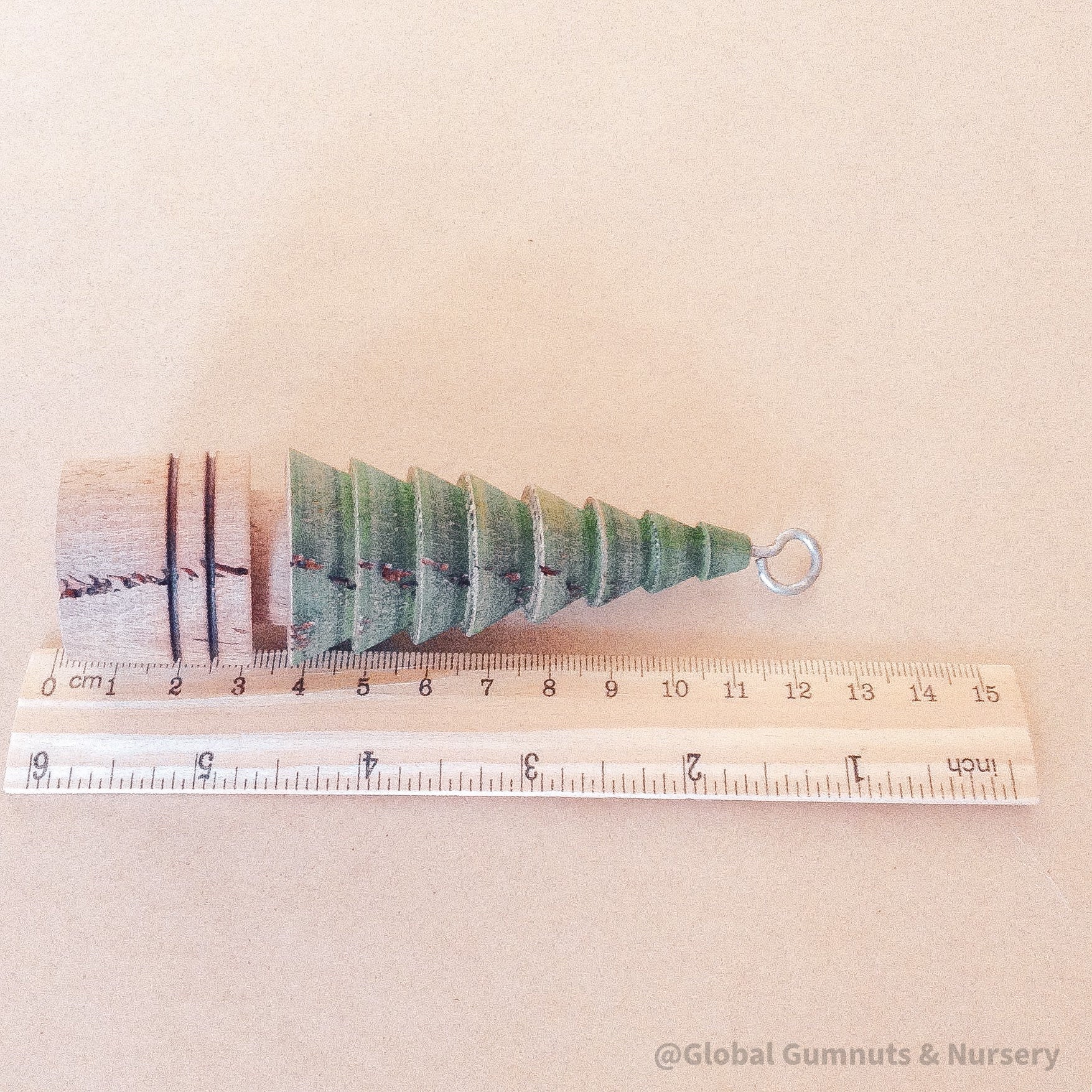 Vintage-inspired handcrafted wood turner Christmas tree, wooden with a hook.
