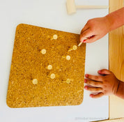 CORK and Tools Set: Kids’ wooden hammer and nail set with corkboard and wooden nails for creative crafting and playdough fun.