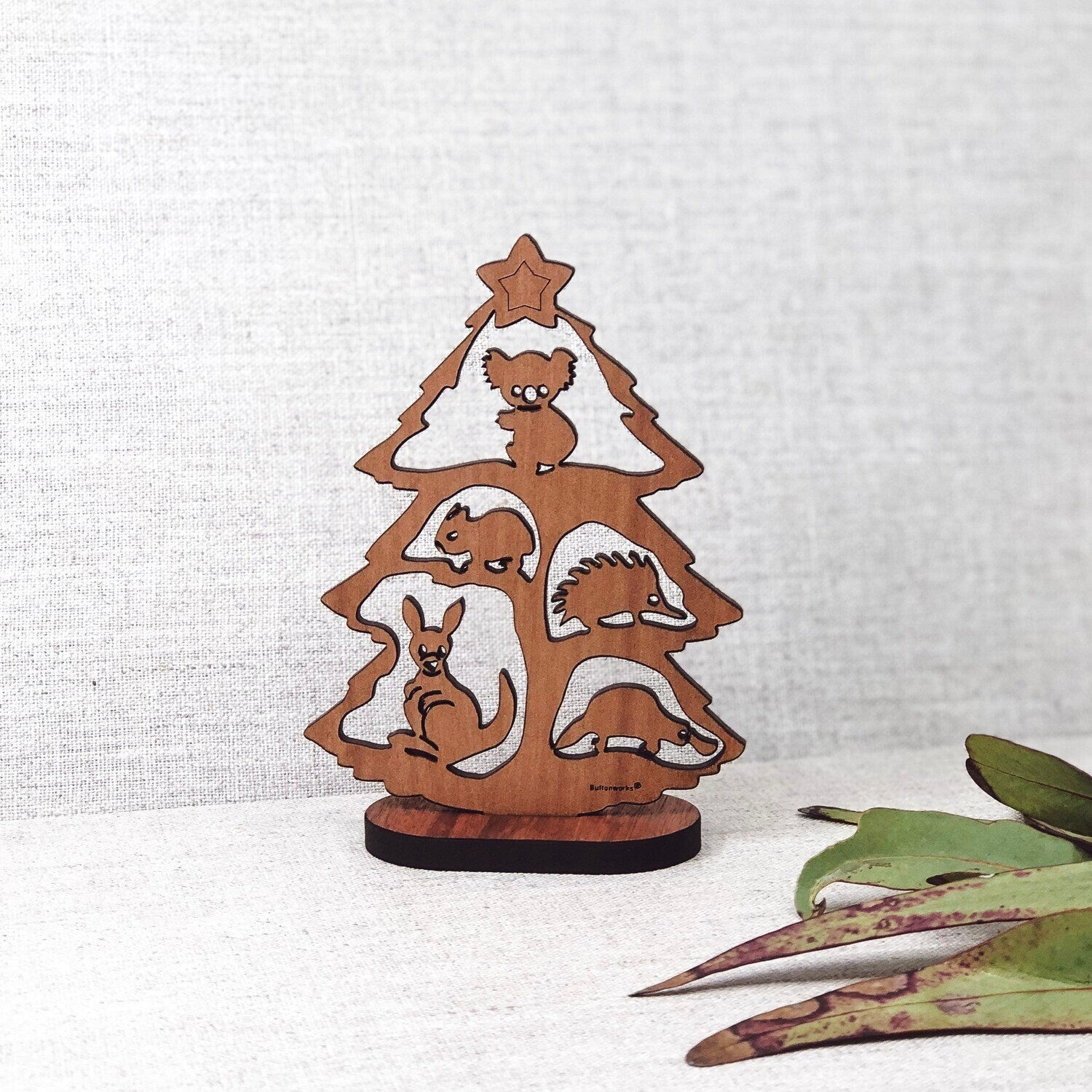 Small Australian Christmas tree scene (Gumtree) with stand, perfect for festive decor.