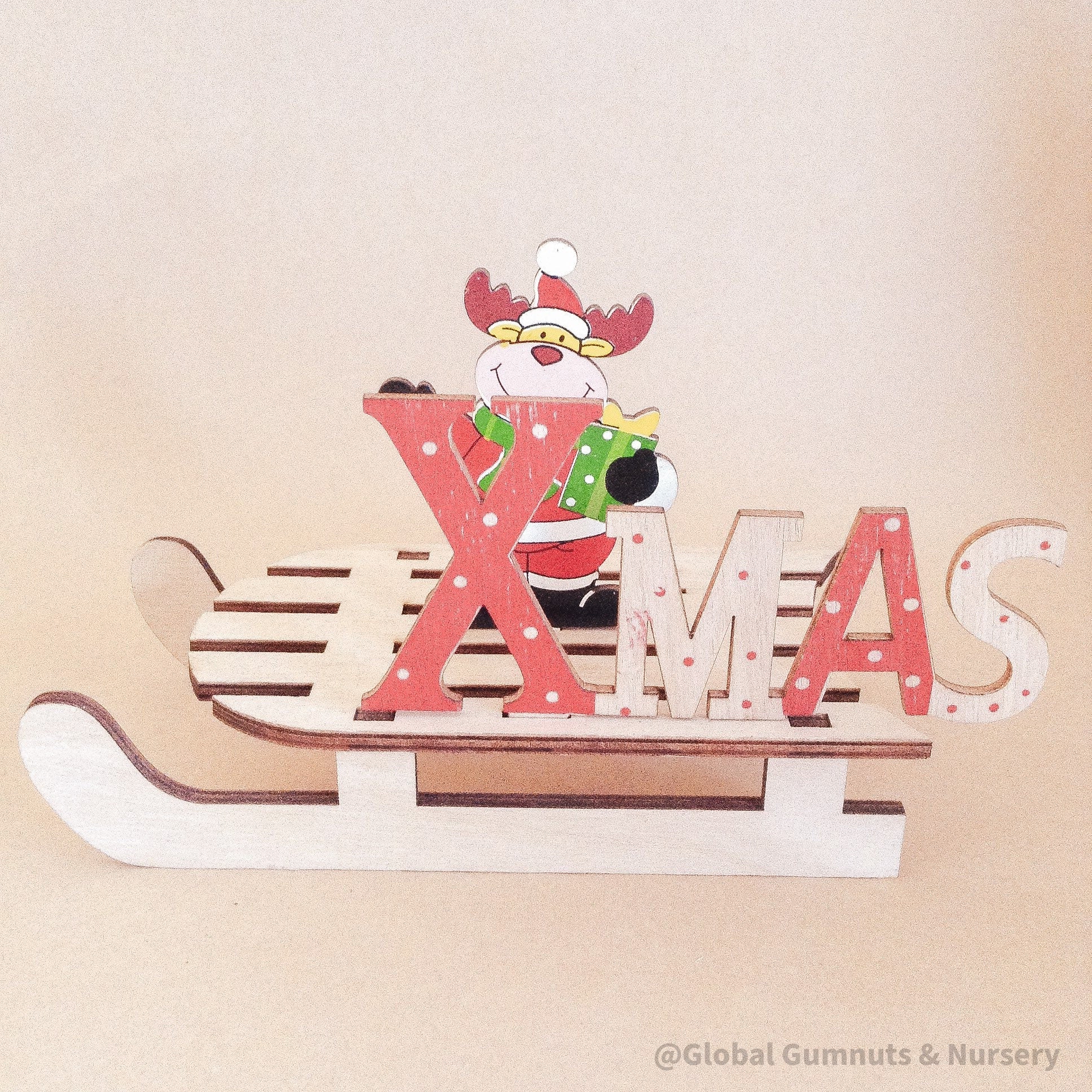 Wooden Christmas sleigh, perfect for imaginative holiday play or as a festive decoration.