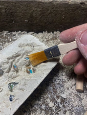 Geology dig kit featuring opal excavation blocks and tools, perfect for budding geologists and sensory play.