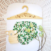 Wooden coat hanger featuring gumnuts and eucalyptus designs, bringing a touch of Australian nature to your closet.