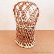 Vintage wicker doll's chair, measuring 20cm x 10cm.