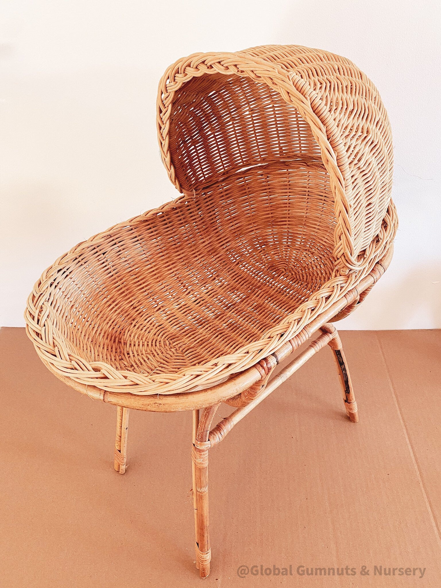 Vintage wicker dolls bassinet, a charming two-piece rattan set.
