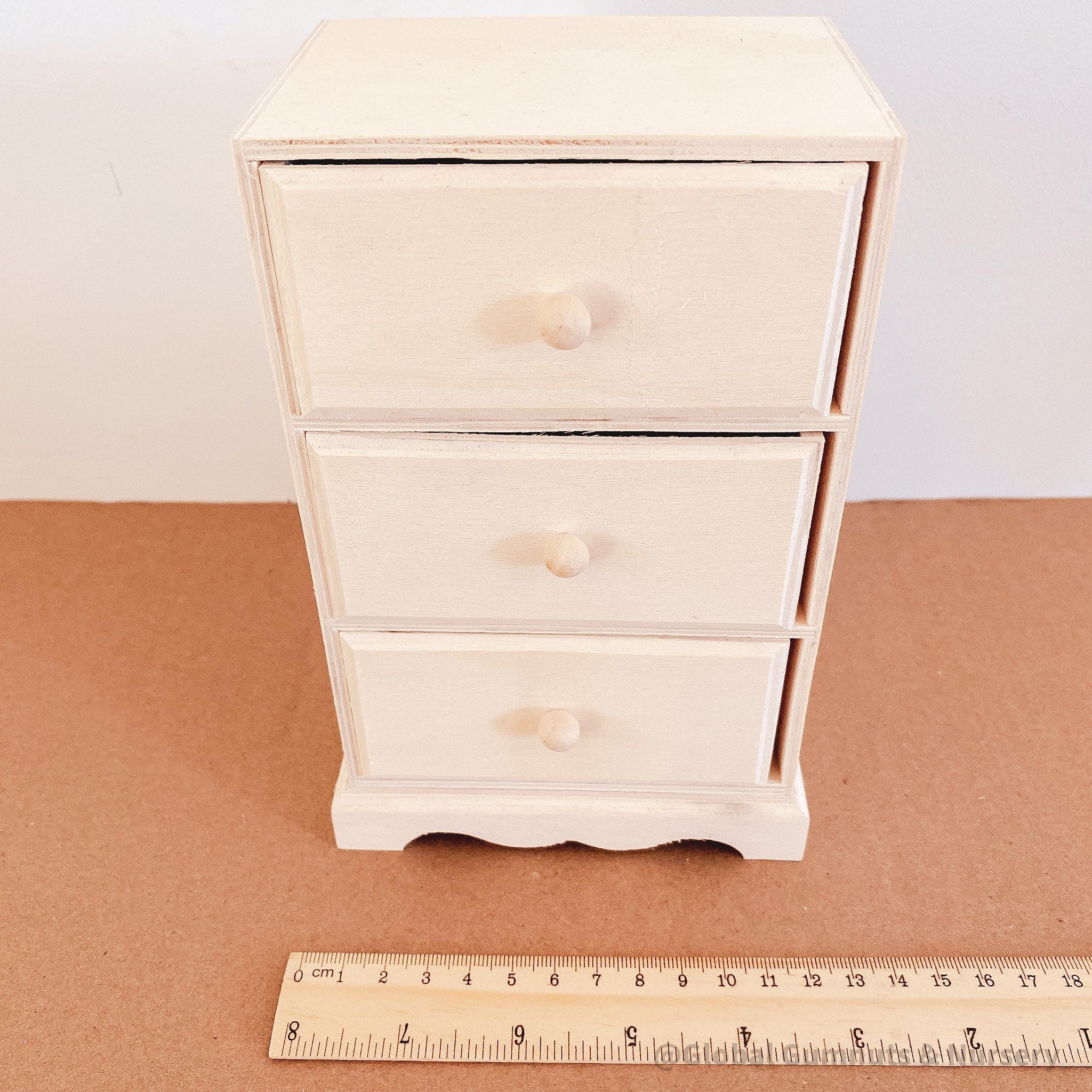 Dollhouse wooden chest of drawers, ready to paint or decorate. Perfect for miniature furniture enthusiasts.