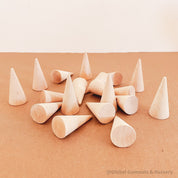 Natural mini wooden forest, featuring raw wooden Christmas trees for holiday crafts or decor.
