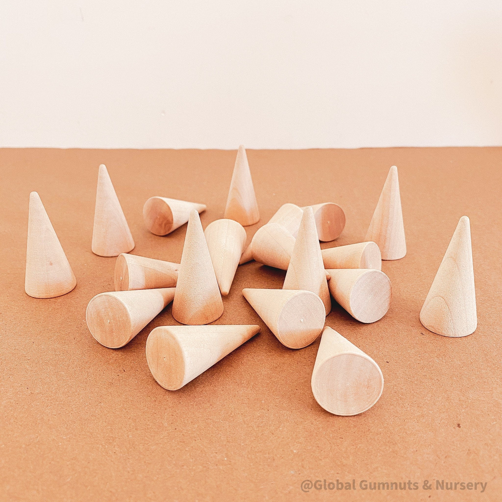 Natural mini wooden forest, featuring raw wooden Christmas trees for holiday crafts or decor.
