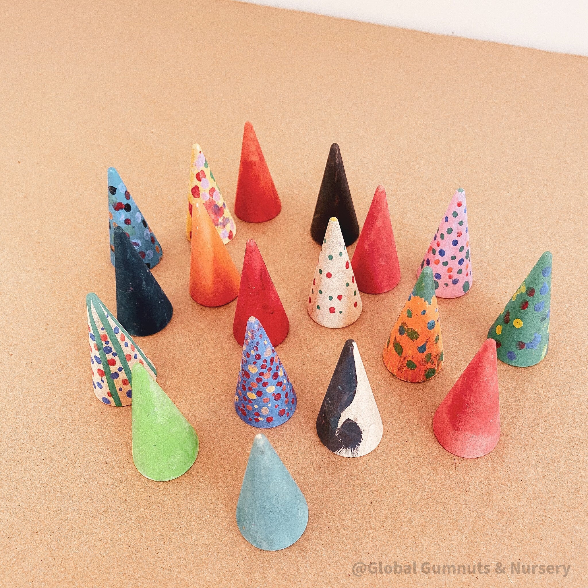 Mini wooden forest set, featuring hand-painted Christmas trees created by children.

