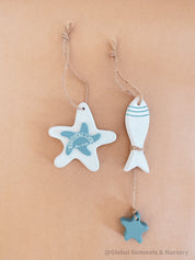 Coastal-themed wooden starfish and fish decor set, perfect for beach-inspired decor or nautical crafts.