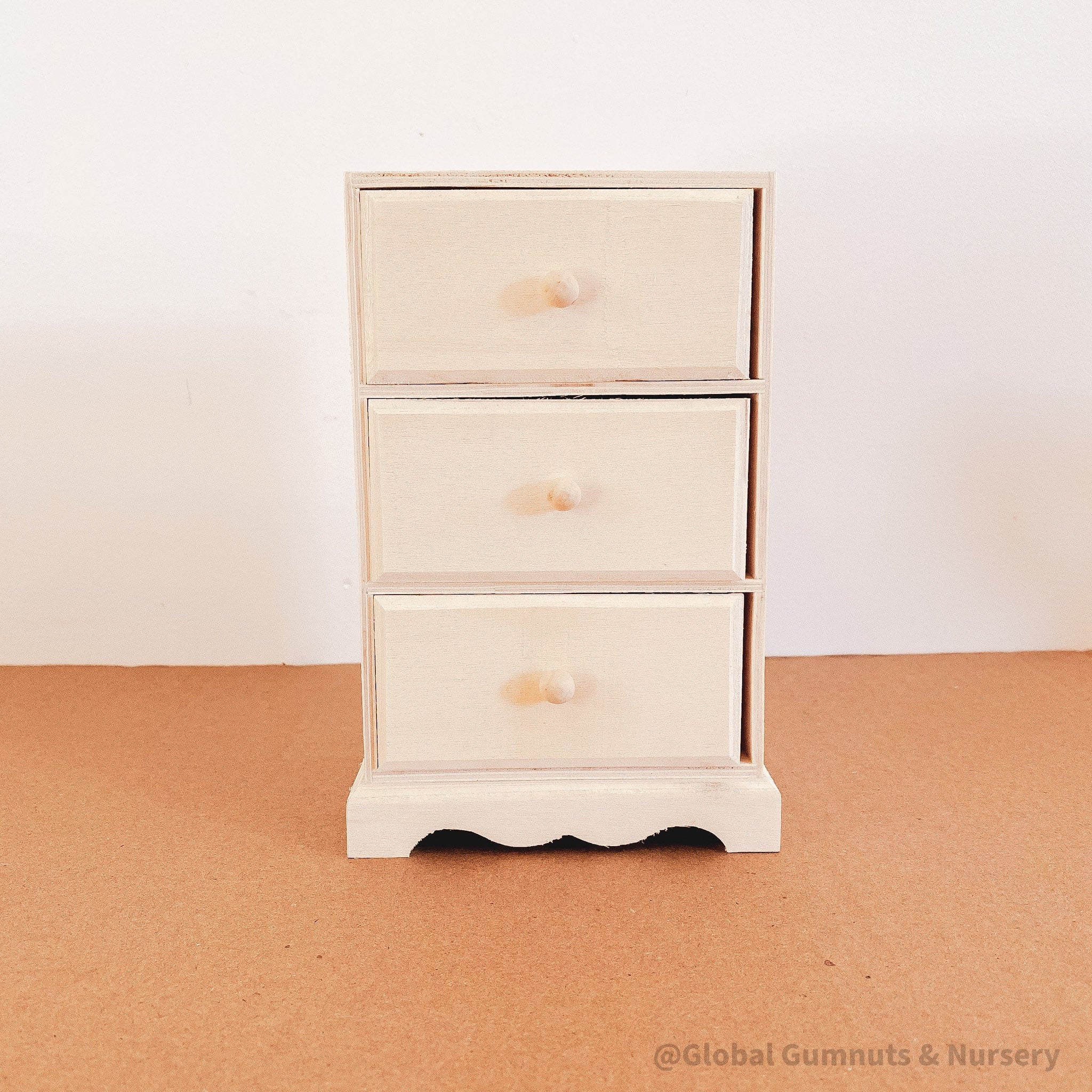 Dollhouse wooden chest of drawers, ready to paint or decorate. Perfect for miniature furniture enthusiasts.