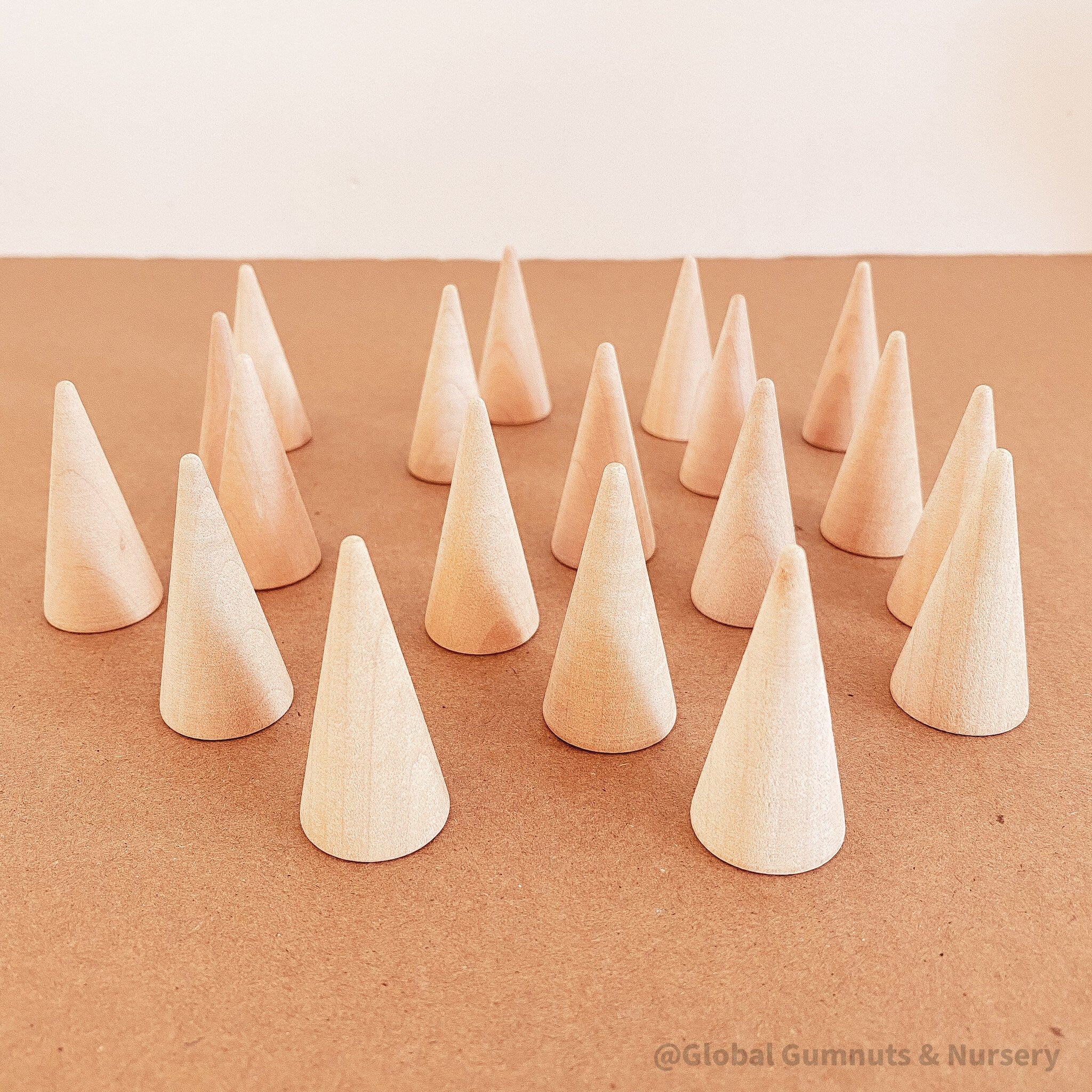 Natural mini wooden forest, featuring raw wooden Christmas trees for holiday crafts or decor.
