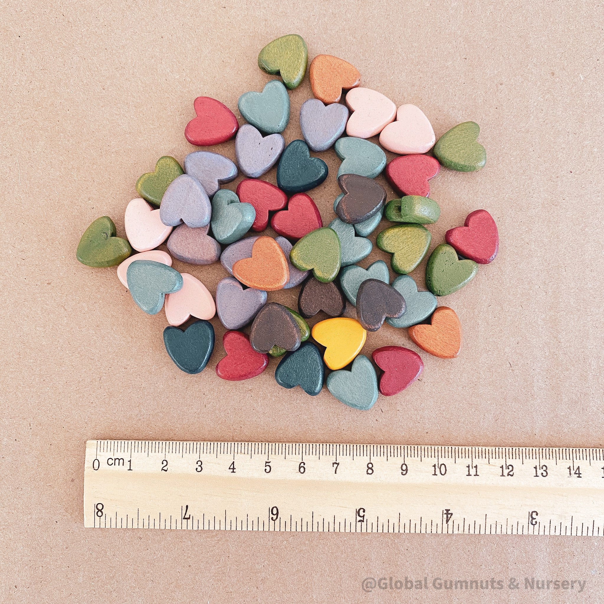 Set of 10 colorful 15mm wooden hearts, ideal for crafting, decorating, or adding charm to DIY projects.
