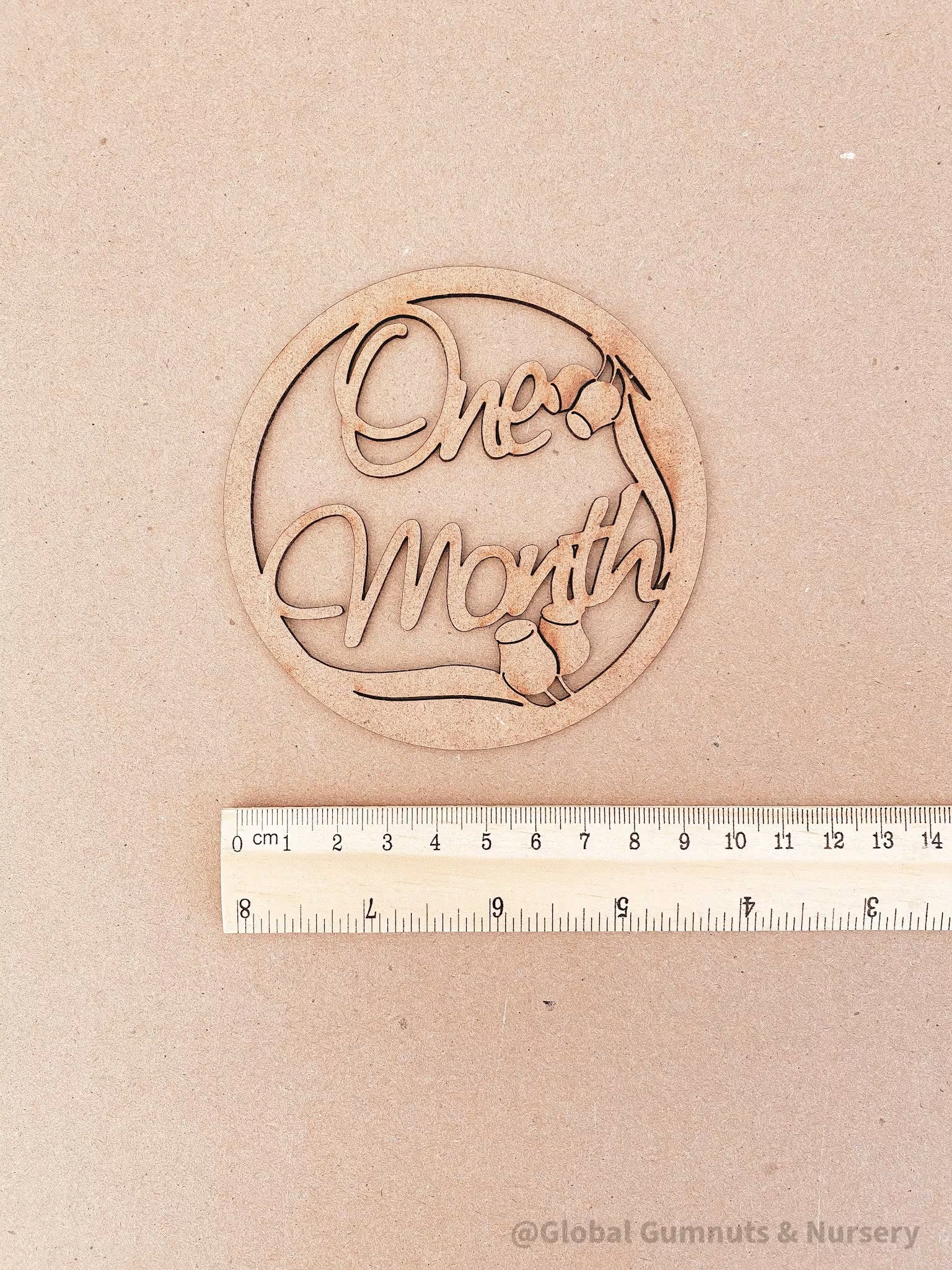 1-Month Milestone Disc: Elegant wooden disc to celebrate a baby's first month.

