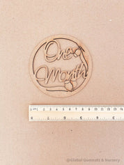 1-Month Milestone Disc: Elegant wooden disc to celebrate a baby's first month.
