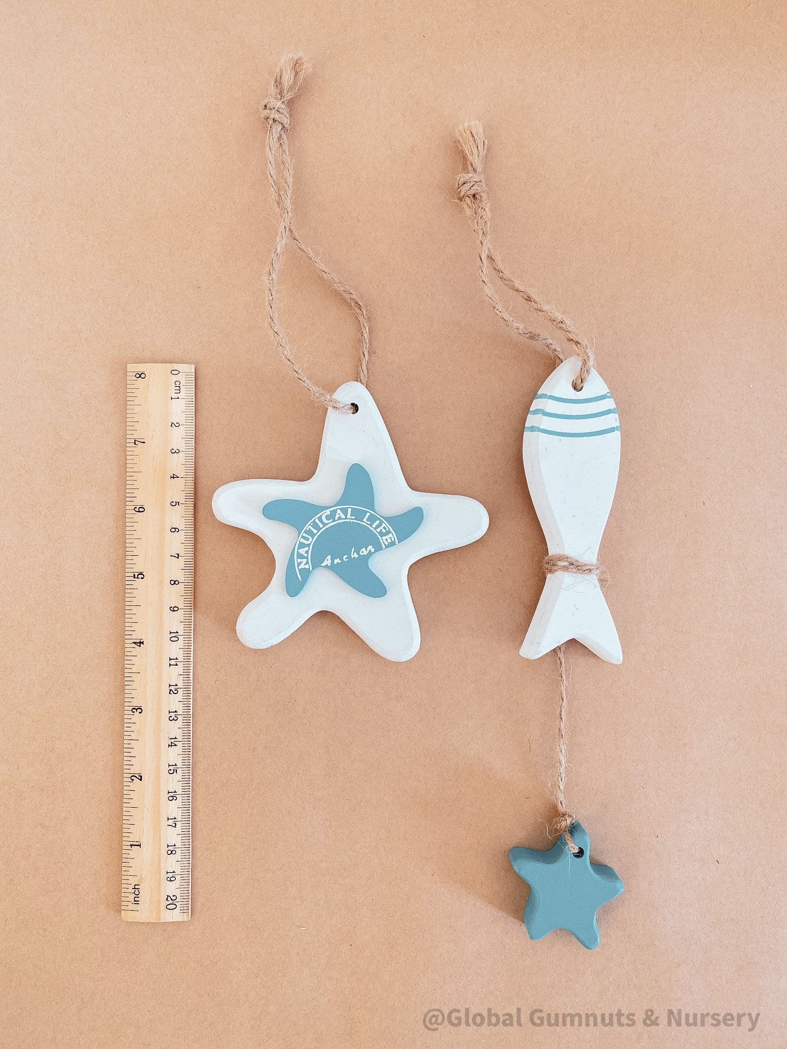 Coastal-themed wooden starfish and fish decor set, perfect for beach-inspired decor or nautical crafts.