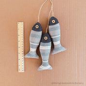 Seaside serenity ocean breeze fabric fish trio, a charming decor set.
