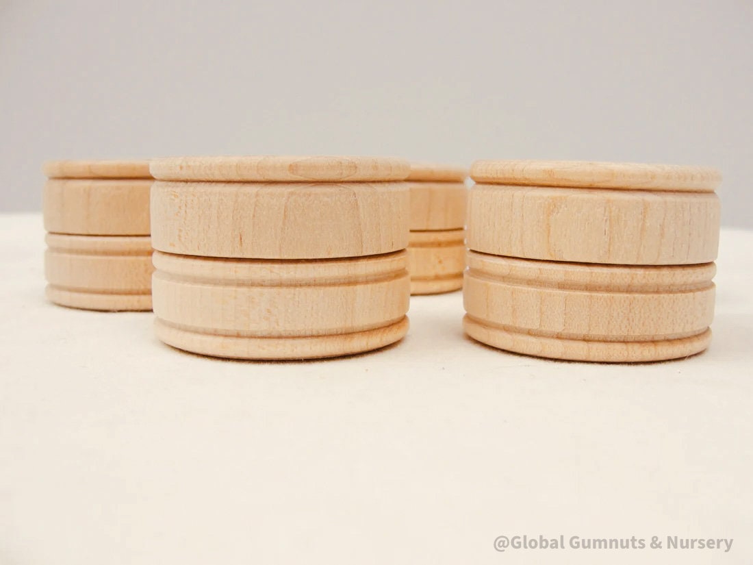 Tooth fairy keepsake jar, a wooden container for storing small treasures like teeth, hair locks, or rings.