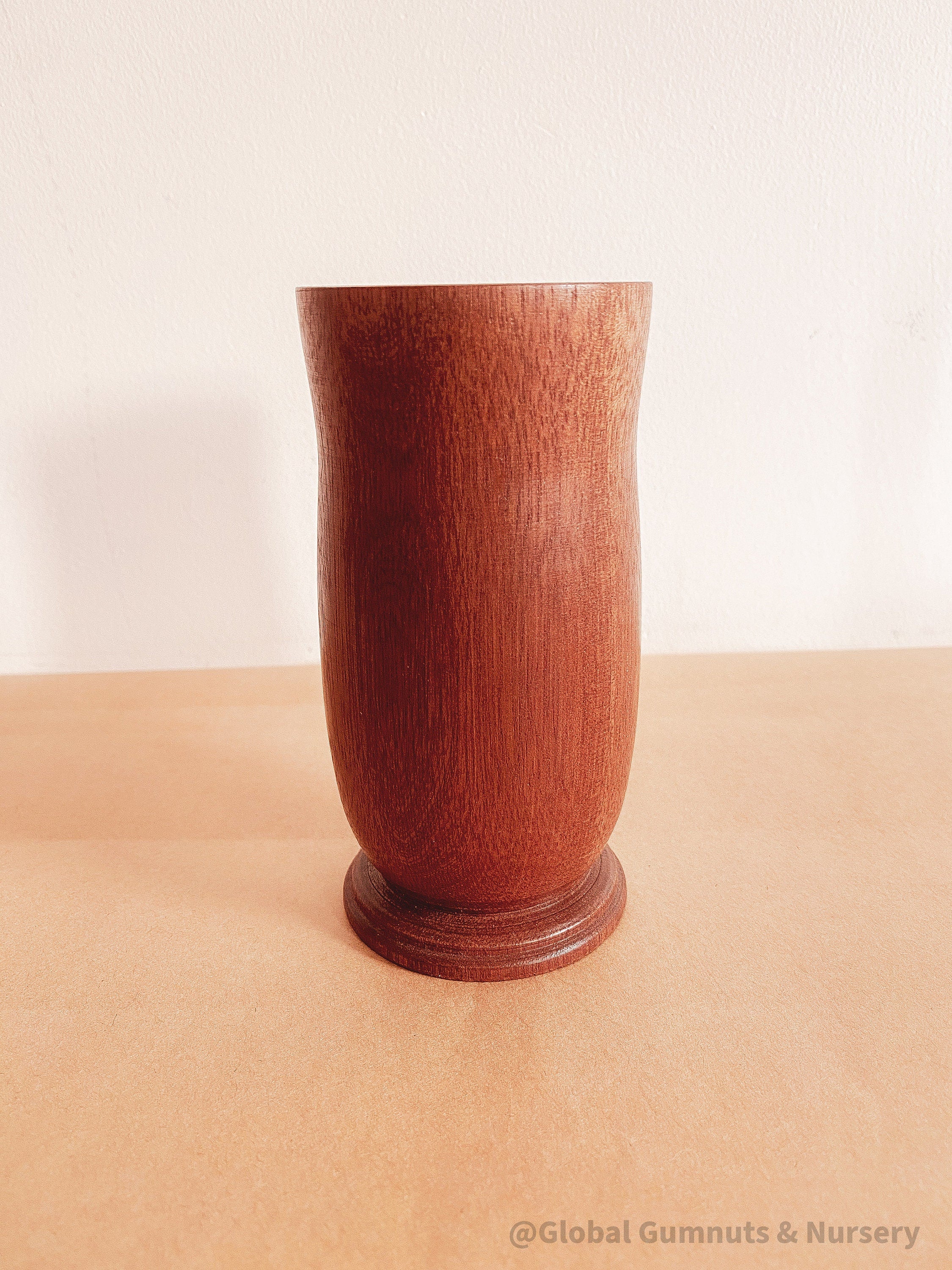 Tall Jarrah vase, a beautiful decor piece for floral arrangements.