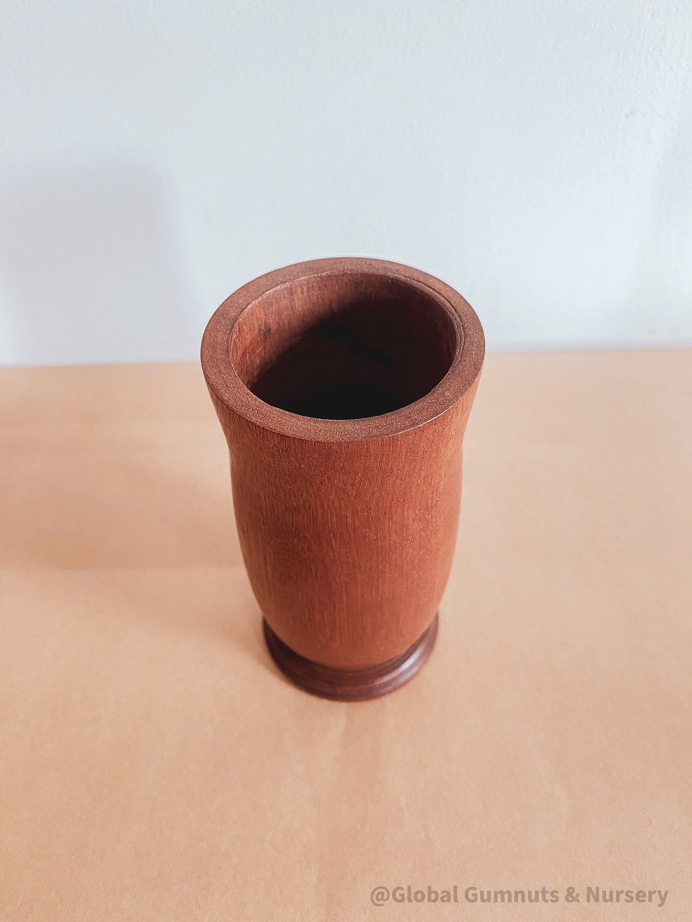 Tall Jarrah vase, a beautiful decor piece for floral arrangements.