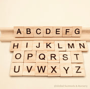 26-piece wooden uppercase letter tiles, ideal for teaching letter recognition, Scrabble, and creative craft projects.