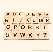 26-piece wooden uppercase letter tiles, ideal for teaching letter recognition, Scrabble, and creative craft projects.