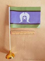 Torres Strait Islander Flag Ornament: Wooden flag on a pole for NAIDOC Week displays.