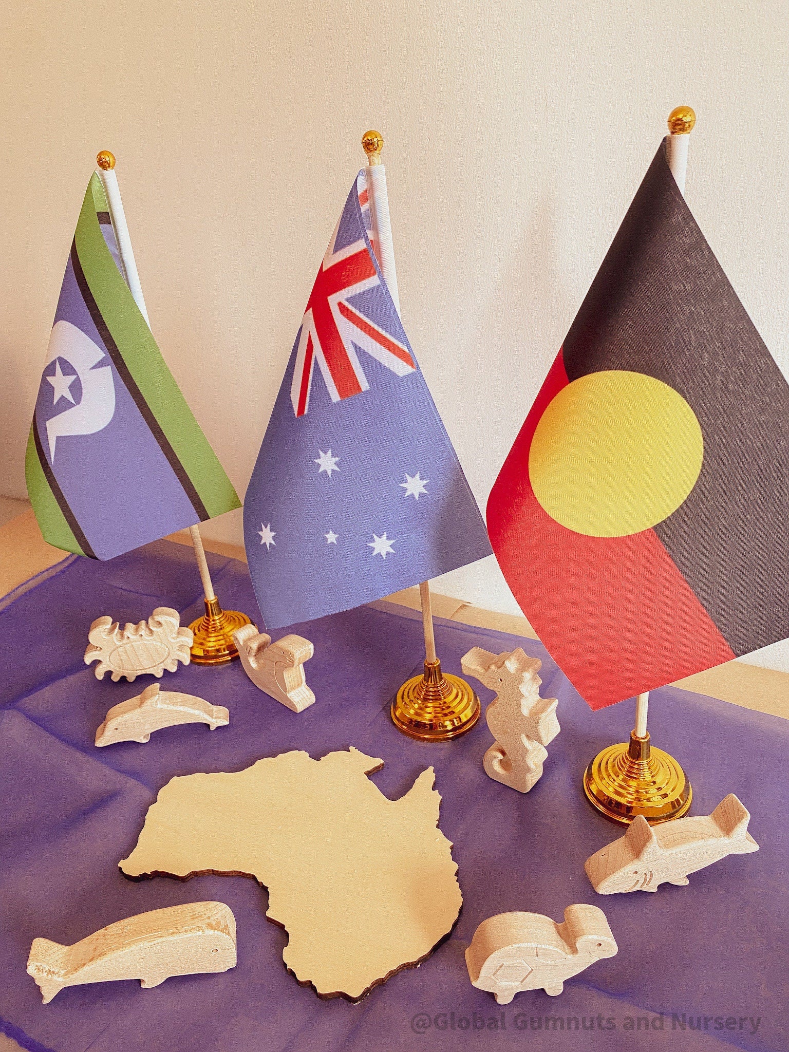 Torres Strait Islander Flag Ornament: Wooden flag on a pole for NAIDOC Week displays.