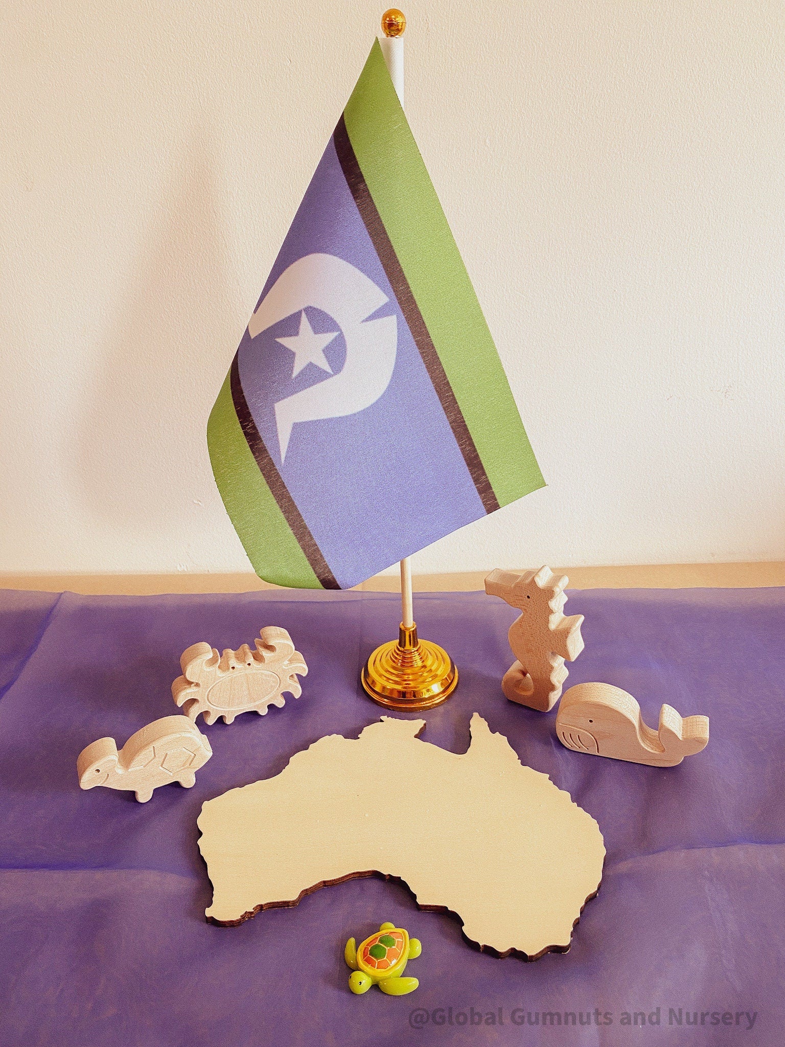 Torres Strait Islander Flag Ornament: Wooden flag on a pole for NAIDOC Week displays.