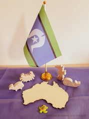 Torres Strait Islander Flag Ornament: Wooden flag on a pole for NAIDOC Week displays.