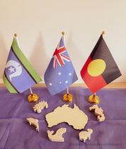 Australian Flag on Wooden Pole: Aboriginal and Australian flag set with optional felt balls.