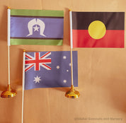 Torres Strait Islander Flag Ornament: Wooden flag on a pole for NAIDOC Week displays.