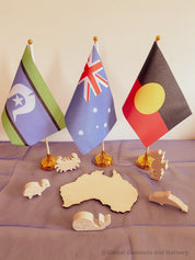 Torres Strait Islander Flag Ornament: Wooden flag on a pole for NAIDOC Week displays.