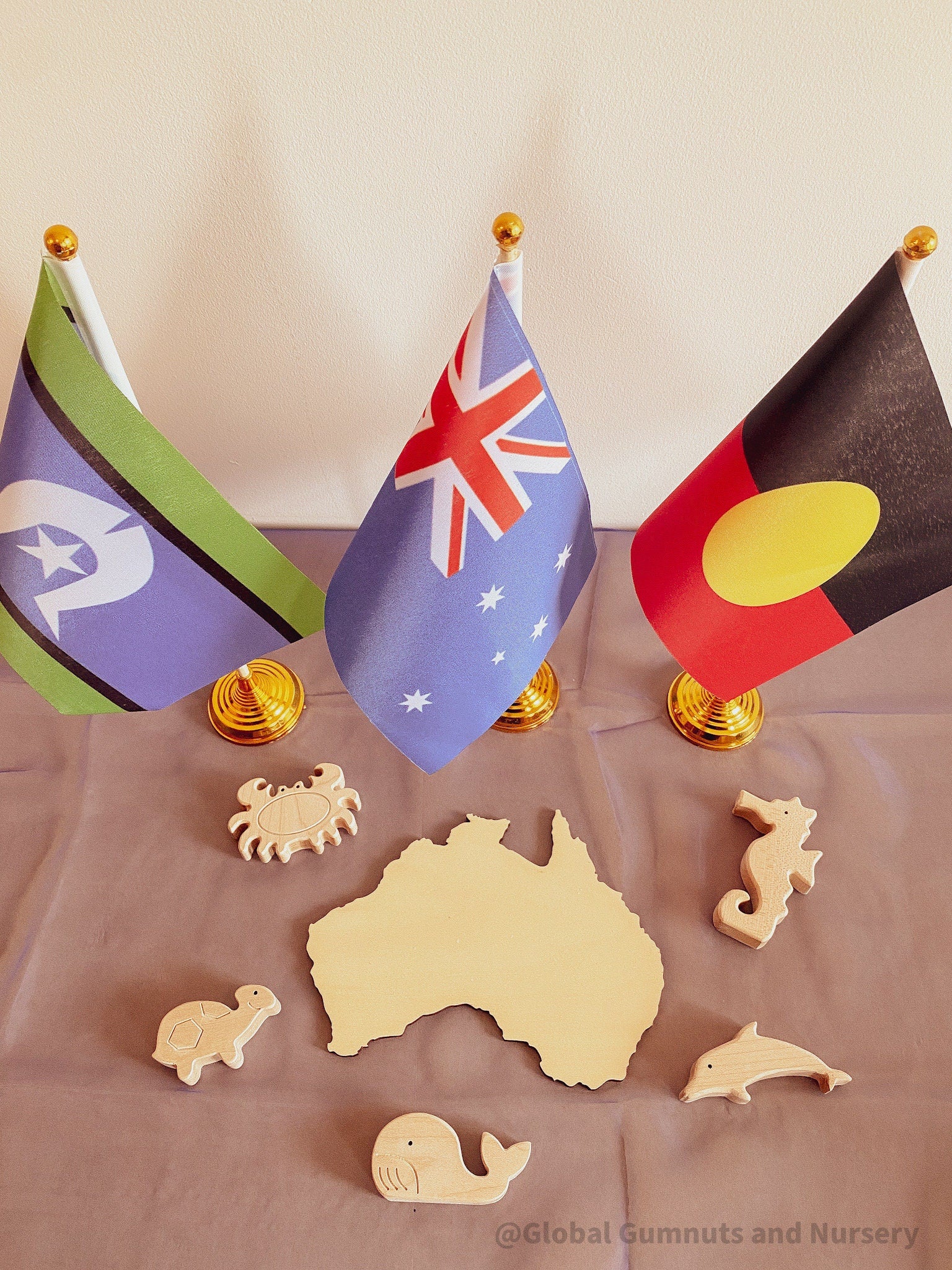Torres Strait Islander Flag Ornament: Wooden flag on a pole for NAIDOC Week displays.