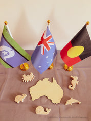 Torres Strait Islander Flag Ornament: Wooden flag on a pole for NAIDOC Week displays.