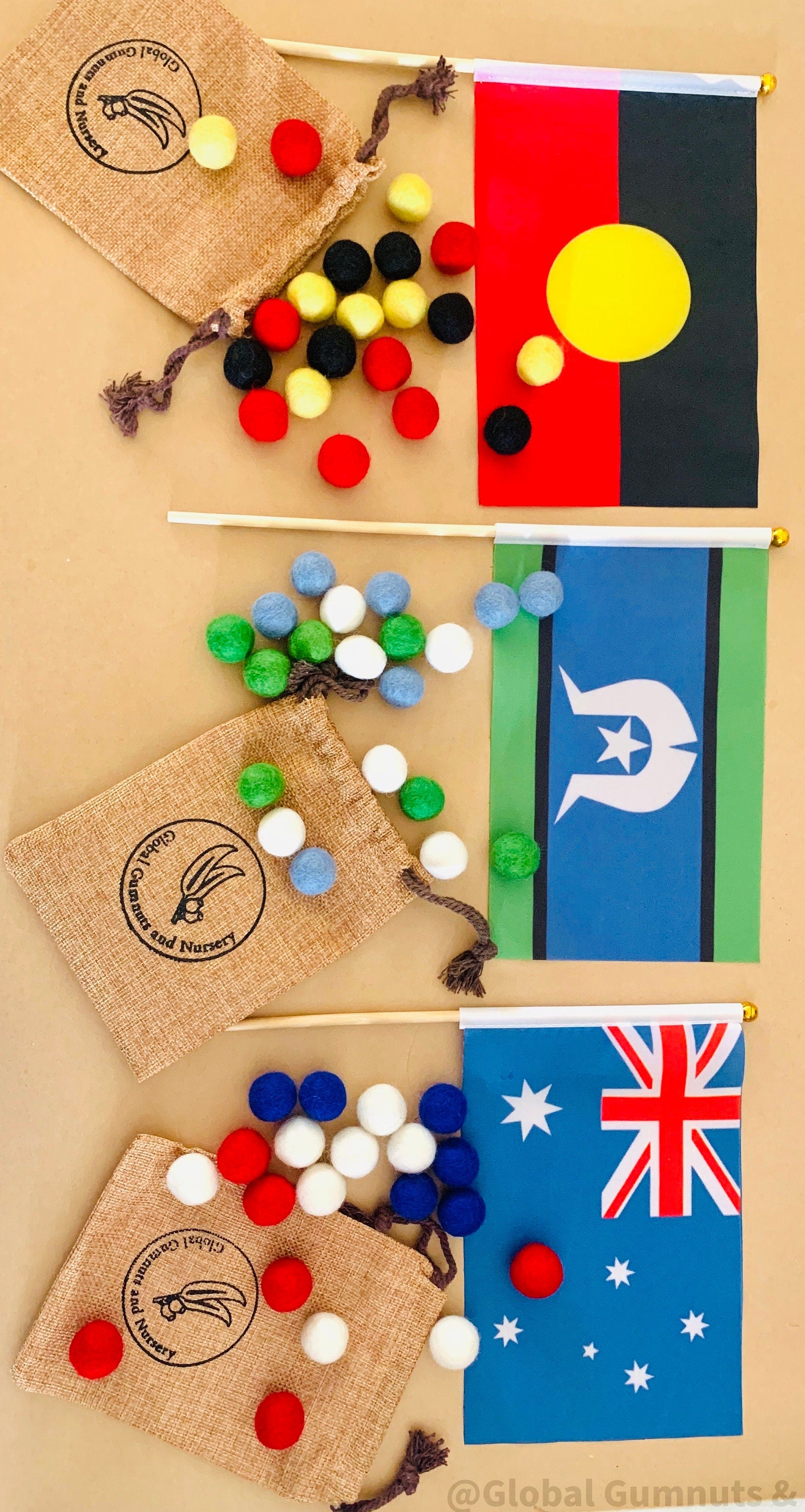 Torres Strait Islander Flag Ornament: Wooden flag on a pole for NAIDOC Week displays.