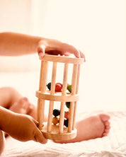 Wooden rainmaker toy in two sizes, a magical sensory and musical toy for kids.